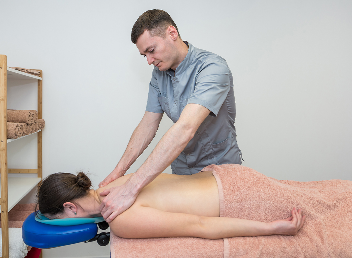 Manual therapy on a patient's back