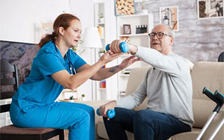 Neuro Physiotherapy Physiotherapist treating a patient at home