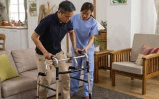 Stroke Rehabilitation Physiotherapist treating a patient at home